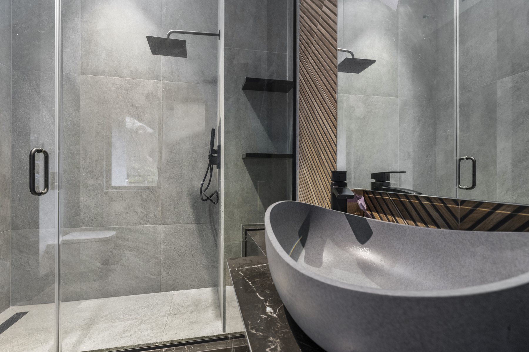 Finished double vanity bathroom with glass shower and matte black fixtures
