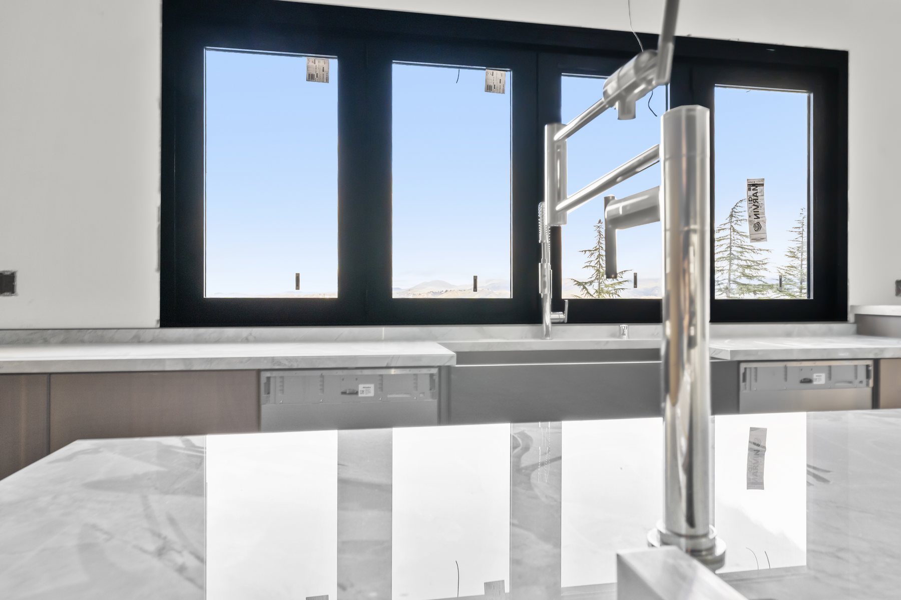Finished luxury kitchen faucet installation by Prime Time Plumbing